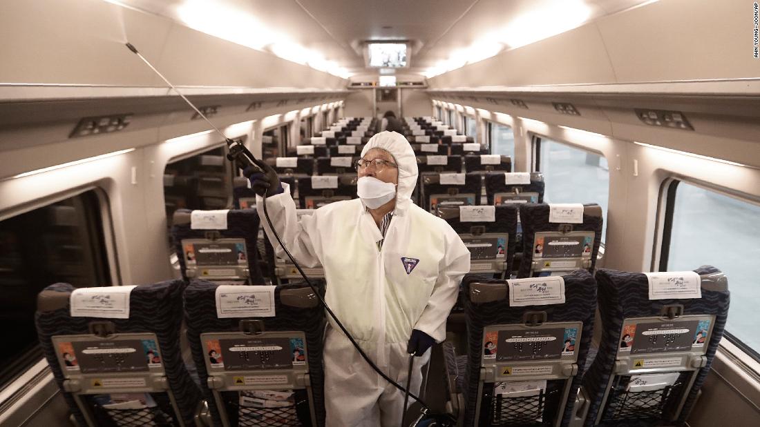 An employee sprays disinfectant on a train in Seoul, South Korea, on January 24. 