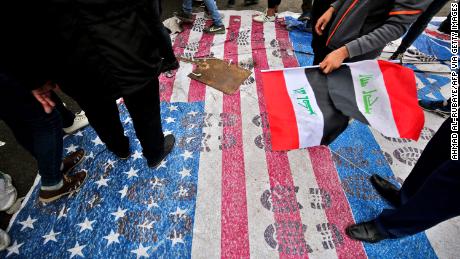 Protesters step on a makeshift US flag after heeding the call of powerful Shia cleric Muqtada al-Sadr for a &quot;Million Man March.&quot; 