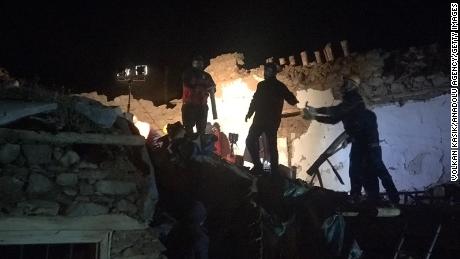 Teams conduct search operations for survivors of a collapsed building in Malatya province.