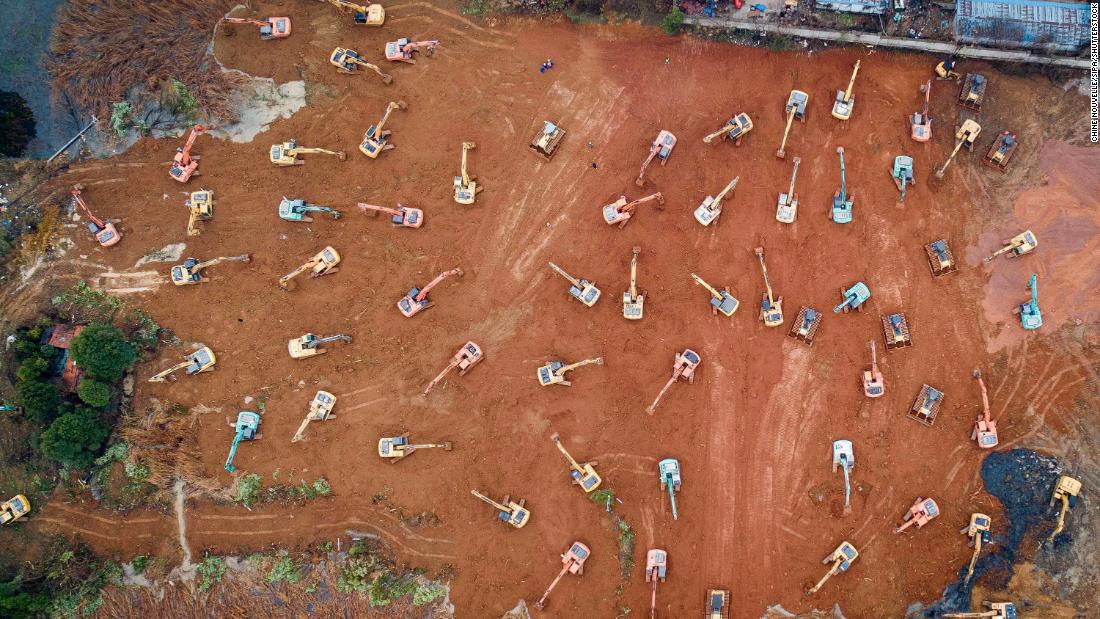 Construction workers in Wuhan begin to work on a special hospital to deal with the outbreak on Friday, January 24.