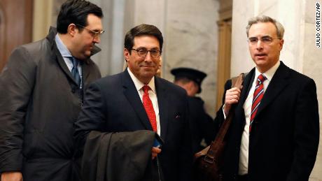 President Donald Trump&#39;s personal attorney Jay Sekulow, center, stands with his son, Jordan Sekulow, left, and White House Counsel Pat Cipollone, while arriving at the Capitol in Washington during the impeachment trial of President Donald Trump on charges of abuse of power and obstruction of Congress, Saturday, Jan. 25, 2020. (AP Photo/Julio Cortez)