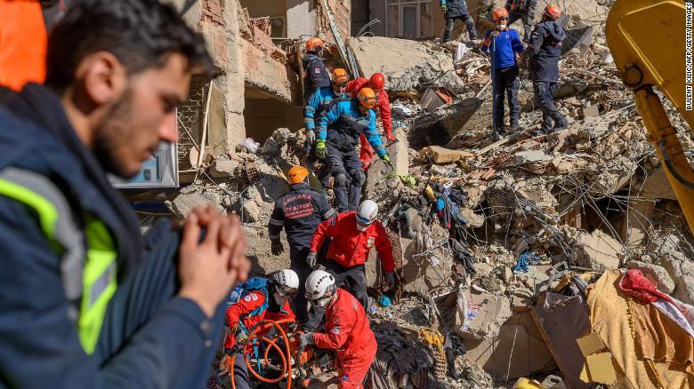 Rescue workers search through the rubble in Elazig Saturday.