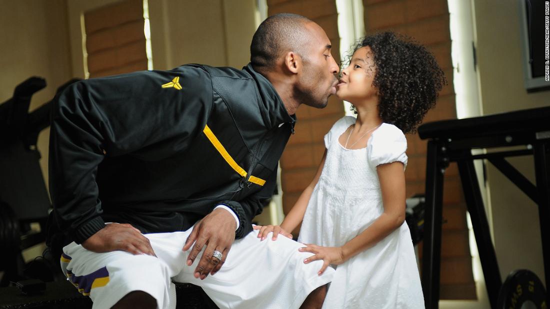 Bryant kisses his daughter Natalia during a 2008 photo session at his home in Newport Beach, California.