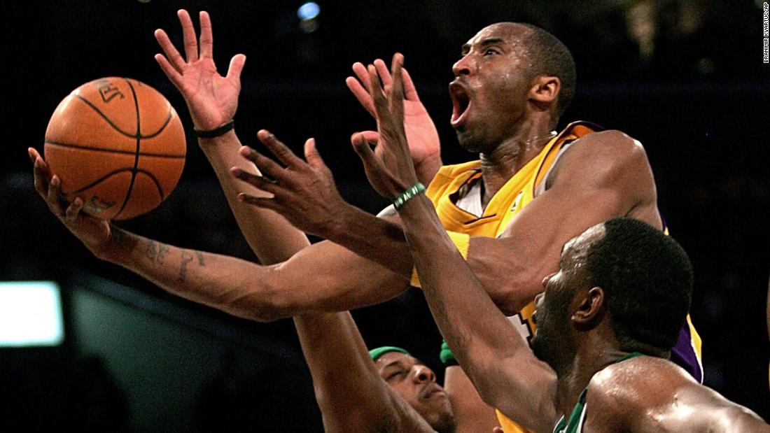 Bryant goes up for a shot between the Boston Celtics&#39; Paul Pierce, left, and Al Jefferson during a 2006 game in Los Angeles.