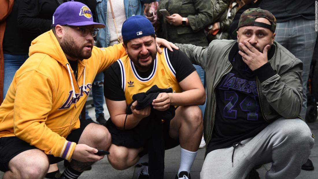 From left, Alex Fultz, Eddy Rivas and Rene Alfaro react to Bryant&#39;s death on Sunday outside of the Staples Center.