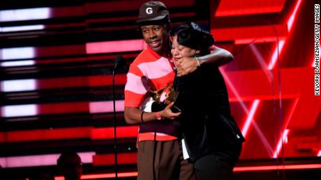 Tyler, the Creator and his mother accept the Best Rap Album award at the Grammys. (Photo by Kevork Djansezian/Getty Images)