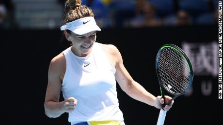 Simona Halep celebrates defeating Elise Mertens at the Australian Open.