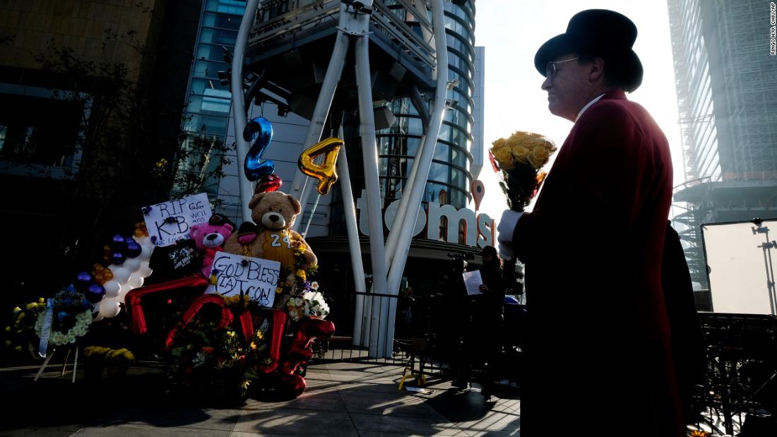 Gregg Donovan holds flowers at a memorial for Kobe Bryant near the Staples Center on January 27.