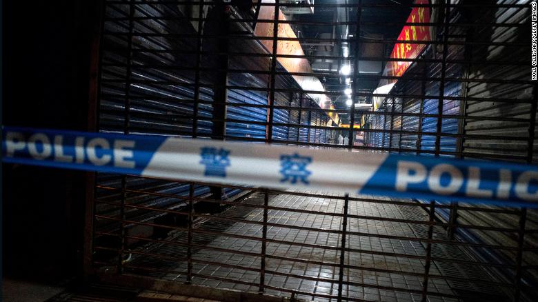 Members of staff of the Wuhan Hygiene Emergency Response Team conduct searches of the closed Huanan Seafood Wholesale Market in the city of Wuhan, in the Hubei Province, on January 11.