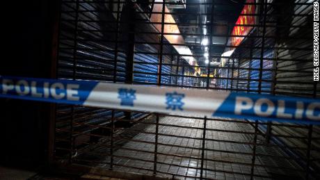 Members of staff of the Wuhan Hygiene Emergency Response Team conduct searches on the closed Huanan Seafood Wholesale Market in the city of Wuhan, in the Hubei Province, on January 11, 2020. 