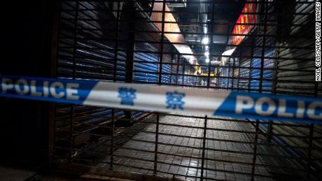 Members of staff of the Wuhan Hygiene Emergency Response Team conduct searches on the closed Huanan Seafood Wholesale Market in the city of Wuhan, in the Hubei Province, on January 11, 2020, where the Wuhan health commission said that the man who died from a respiratory illness had purchased goods. - China said on January 11, 2020 that a 61-year-old man had become the first person to die from a respiratory illness believed to be caused by a new virus from the same family as SARS (Sudden Acute Respiratory Syndrome), which claimed hundreds of lives more than a decade ago. Forty-one people with pneumonia-like symptoms have so far been diagnosed with the new virus in Wuhan, with one of the victims dying on January 8, 2020, the central Chinese city&#39;s health commission said on its website. (Photo by NOEL CELIS / AFP) (Photo by NOEL CELIS/AFP via Getty Images)