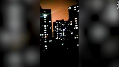 Viral video online showing Wuhan residents shouting &quot;Go, Wuhan!&quot; from their apartment windows.