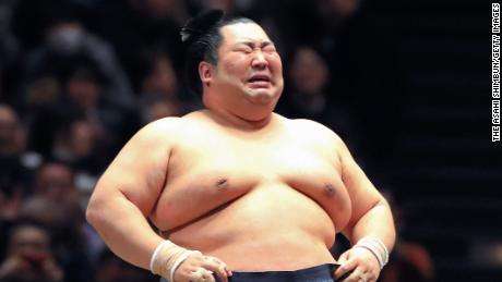 Tokushoryu sheds tears of joy after winning the tournament at the Ryogoku Kokugikan in Tokyo, Japan. 