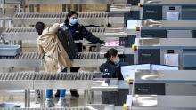 Members of security wear facemasks inside the high-speed train station connecting Hong Kong to mainland China during a public holiday in celebration of the Lunar New Year in Hong Kong on January 28, 2020, as a preventative measure following a virus outbreak which began in the Chinese city of Wuhan. - China on January 28 urged its citizens to postpone travel abroad as it expanded unprecedented efforts to contain a viral outbreak that has killed 106 people and left other governments racing to pull their nationals from the contagion&#39;s epicentre.