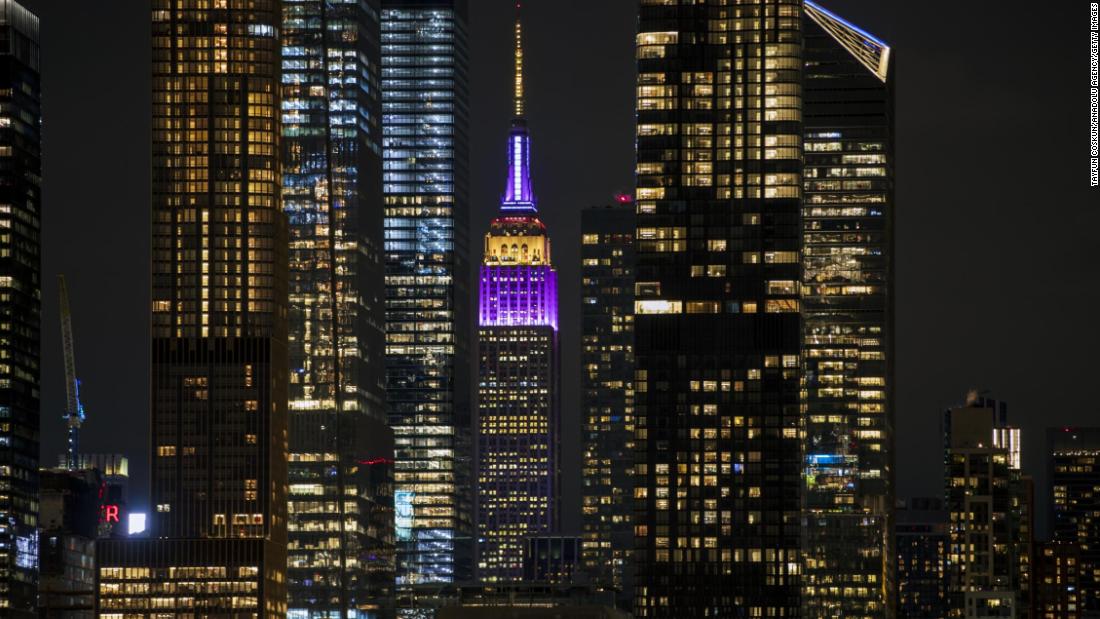 The Empire State Building is illuminated gold and purple to honor Kobe Bryant on January 28. 