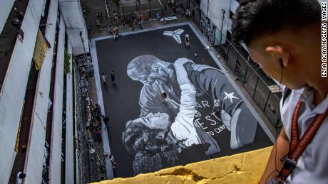 A giant mural of NBA legend Kobe Bryant and his 13-year-old daughter, Gianna, is seen on a basketball court in Taguig, Philippines, on January 28. It was painted two days earlier, just hours after the Bryants and seven other people were killed in a helicopter crash in California.