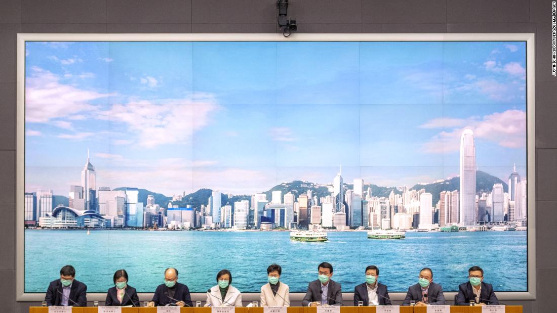 Hong Kong Chief Executive Carrie Lam, center, attends a news conference in Hong Kong on January 28, 2020. Lam said China would stop individual travelers to Hong Kong while closing some border checkpoints and restricting flights and train services from the mainland.