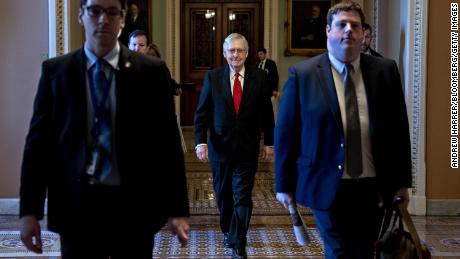 Senate Majority Leader Mitch McConnell, a Republican from Kentucky, center, arrives to the US Capitol on Tuesday, January 21.