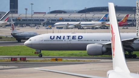 A United Airlines Boeing 777 aircraft waits to take off at Beijing airport on July 25, 2018. - Beijing hailed &quot;positive steps&quot; as major US airlines and Hong Kong&#39;s flag carrier moved to comply on July 25 with its demand to list Taiwan as part of China, sparking anger on the island. (Photo by GREG BAKER / AFP)        (Photo credit should read GREG BAKER/AFP via Getty Images)