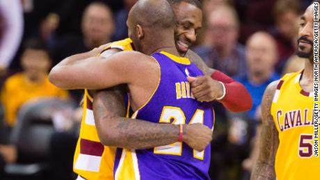 LeBron James greets Kobe Bryant during the first half at Quicken Loans Arena on February 10, 2016 in Cleveland, Ohio. The two men were lifelong friends.