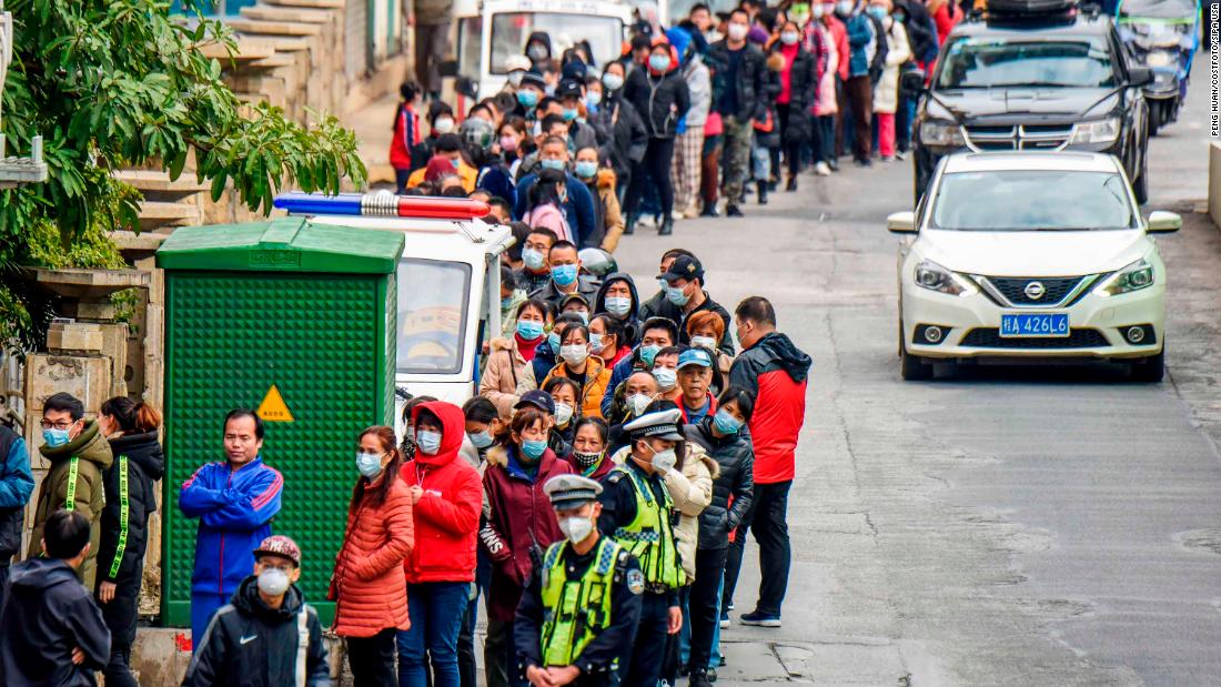 Nanning residents line up to buy face masks from a medical appliance store on January 29.