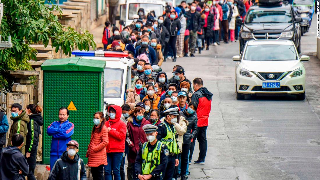 Nanning, China, residents line up to buy face masks from a medical appliance store on January 29, 2020.