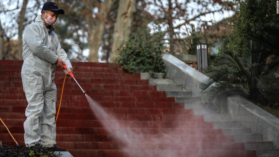 A worker disinfects the grounds near the Wuhan Huoshenshan hospital construction site on January 28.