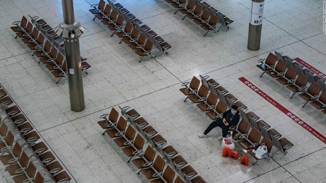 A lone traveler sits at a gate in the Hong Kong High Speed Rail Station on January 29. The Hong Kong government said it will tighten international travel and border crossings to stop the spread of the virus.
