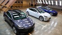 Tesla Model 3 cars are displayed during the Tesla China-made Model 3 Delivery Ceremony in Shanghai. - Tesla CEO Elon Musk presented the first batch of made-in-China cars to ordinary buyers on January 7, 2020 in a milestone for the company&#39;s new Shanghai &quot;giga-factory&quot;, but which comes as sales decelerate in the world&#39;s largest electric-vehicle market. (Photo by STR / AFP) / China OUT (Photo by STR/AFP via Getty Images)