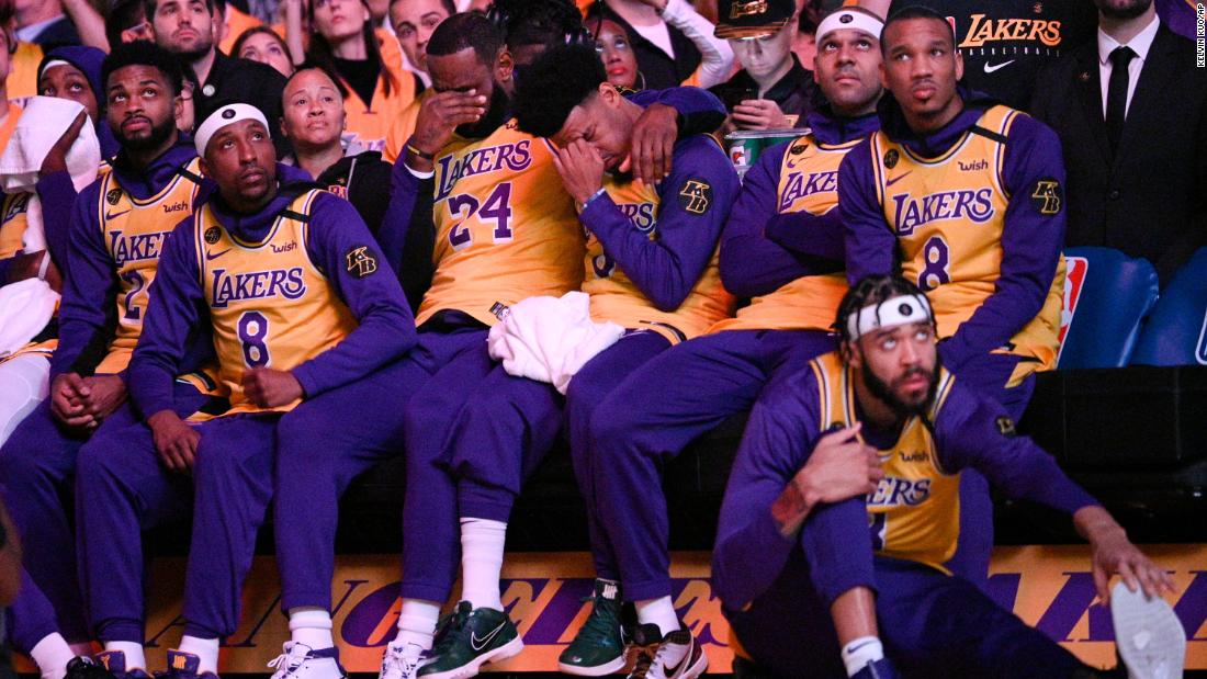 Los Angeles Lakers&#39; LeBron James, center, and Quinn Cook react to a video tribute for Kobe Bryant, before their game against the Portland Trail Blazers on January 31.