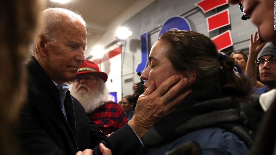 Biden greets a voter in Cedar Rapids on February 1.