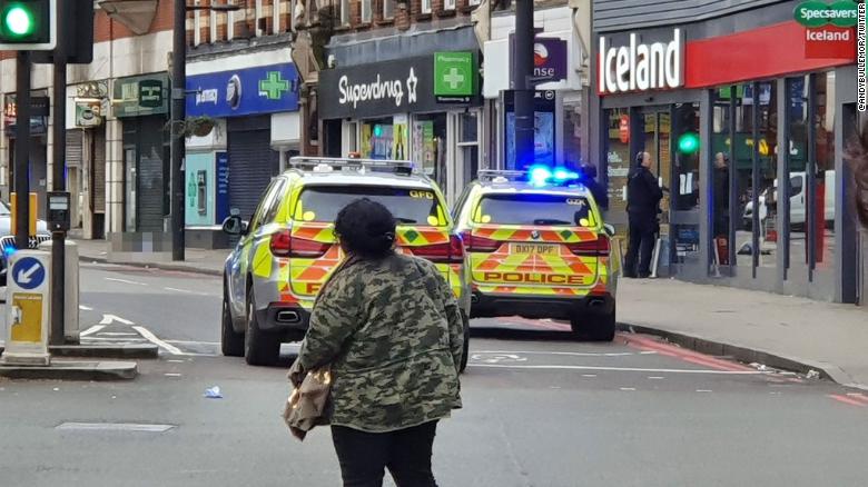 Image from the scene where a man has been shot by armed officers in Streatham. Due to the graphic nature of the scene, CNN has blurred the body of the suspect.