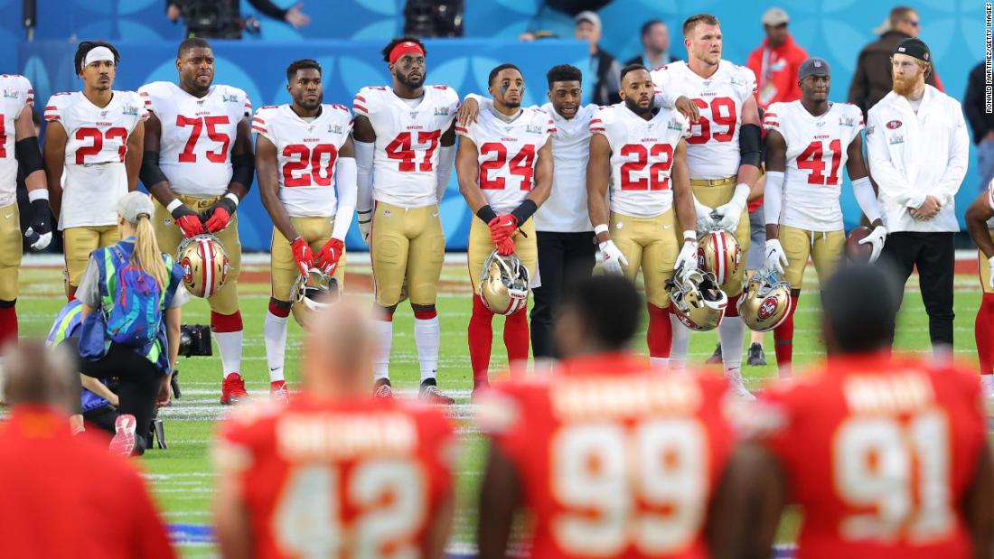 Both teams stand on the 24-yard lines before the game to observe a moment of silence for NBA legend Kobe Bryant, Bryant&#39;s daughter Gianna and other people  who died in a helicopter crash last week.