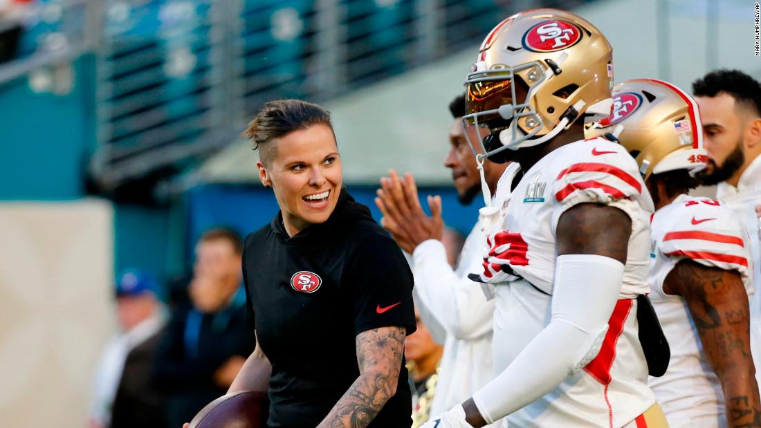 San Francisco 49ers assistant coach Katie Sowers talks with players before the start of the game. She is &lt;a href=&quot;https://www.cnn.com/2020/01/26/us/katie-sowers-super-bowl-spt-trnd/index.html&quot; target=&quot;_blank&quot;&gt;the first woman and openly gay person to coach in a Super Bowl.&lt;/a&gt;