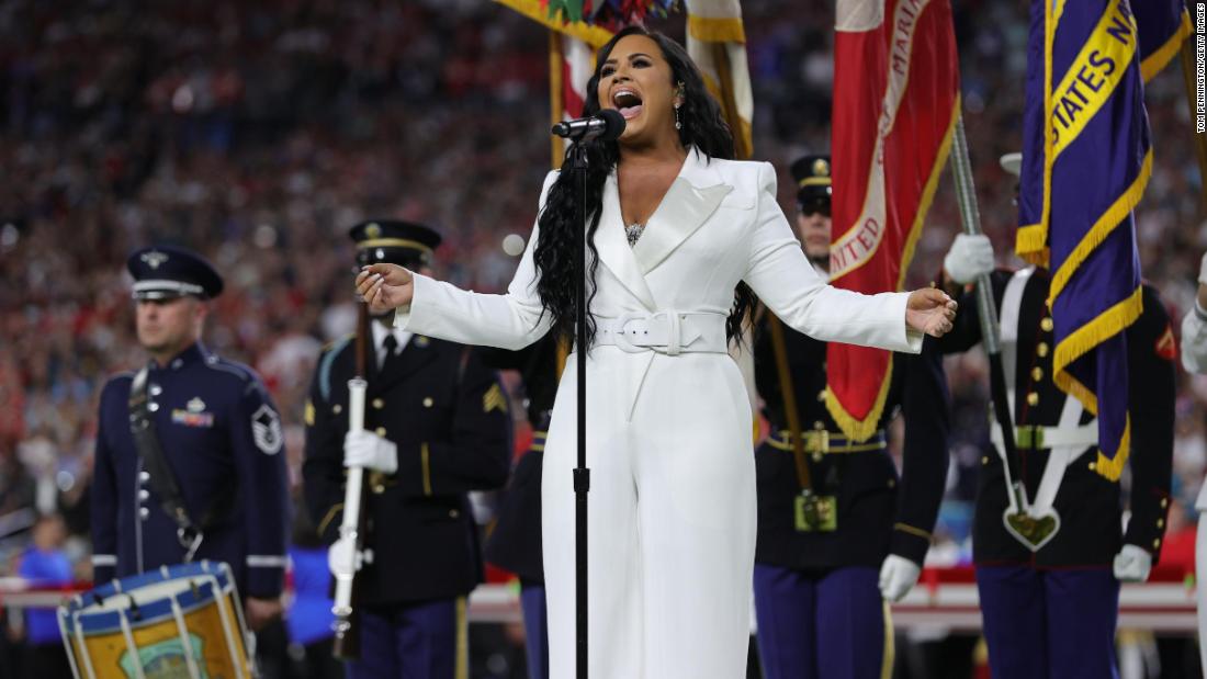 Singer Demi Lovato performs the National Anthem before the game.