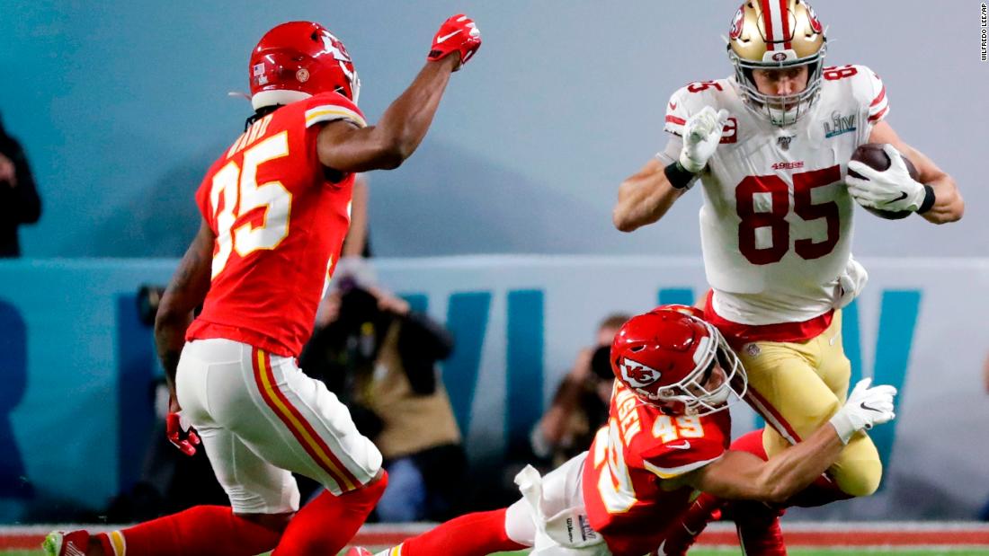 San Francisco tight end George Kittle is tackled by Daniel Sorensen in the first quarter.