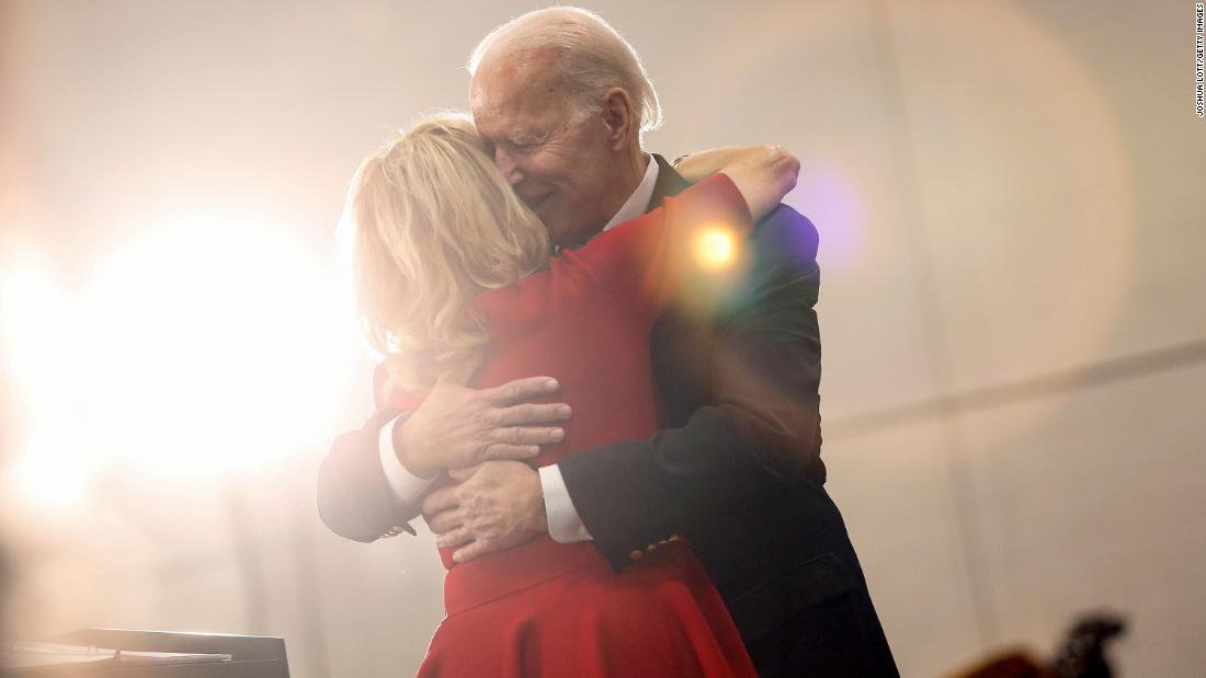 Jill Biden hugs her husband as she introduces him at a campaign event in Des Moines, Iowa.