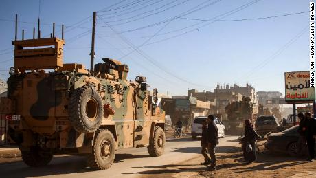 A Turkish military convoy of passes through the Syrian town of Dana on February 2.