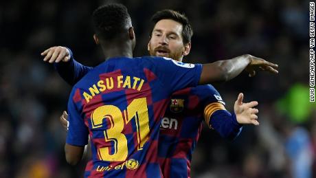 Ansu Fati celebrateshis goal with Lionel Messi.