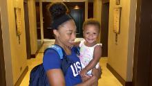 Six-time Olympic gold medalist Allyson Felix holds her daughter, Camryn.