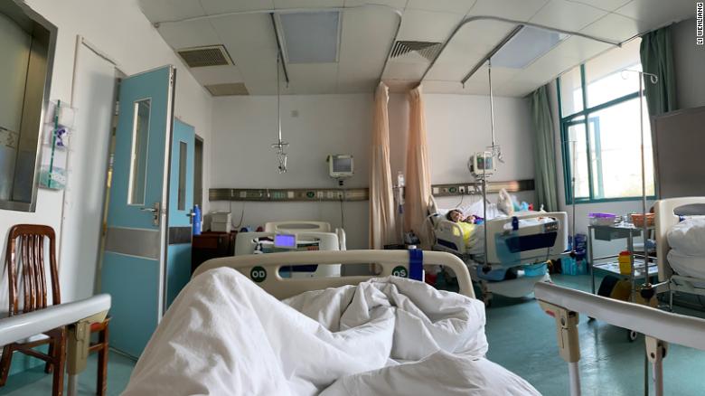 Wuhan doctor Li Wenliang, who contracted the coronavirus from a patient he treated, in an intensive care ward.