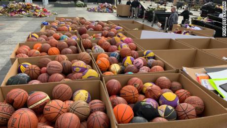 Mourners left more than 1,300 basketballs outside the Staples Center in tribute to Kobe Bryant