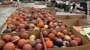 Mourners left more than 1,300 basketballs outside the Staples Center in tribute to Kobe Bryant