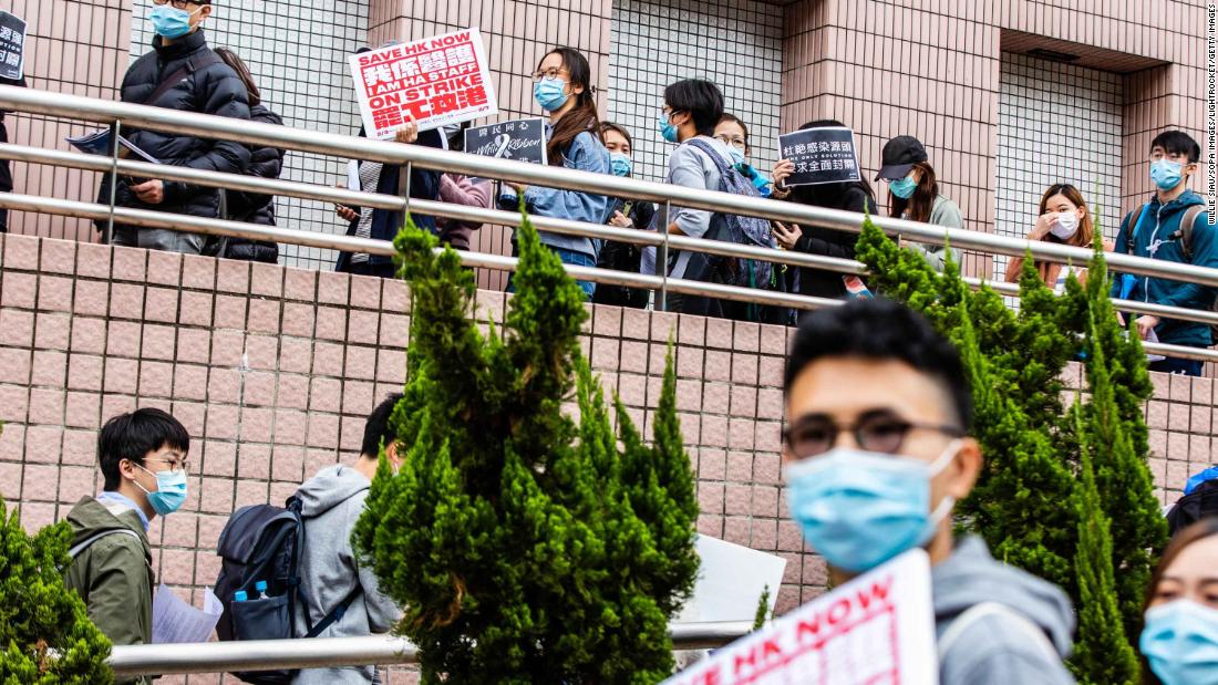 Striking hospital workers in Hong Kong demand the closure of the border with mainland China on February 4.