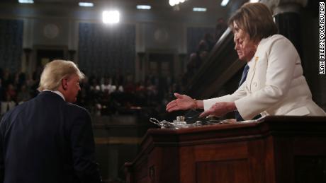 President Donald Trump turns away as Speaker of the House Nancy Pelosi reaches out to shake his hand as he arrives to deliver his State of the Union address to a joint session of the U.S. Congress in the House Chamber of the U.S. Capitol in Washington, U.S. February 4, 2020. REUTERS/Leah Millis/POOL