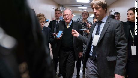 Sen. Lamar Alexander (R-TN) walks from the Senate subway to the Senate chamber to cast a vote in the Senate impeachment trial of President Donald Trump. 