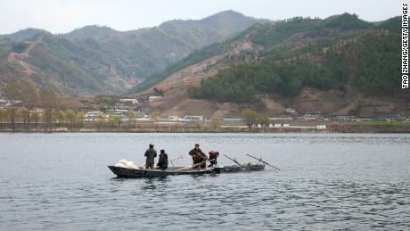 North Koreans ride boats in Yalu River, the border river shared with China, in Qingcheng, North Korea as seen from across the border on April 29, 2019, in Dandong, China.