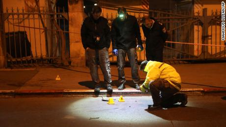 Israeli police officers inspect the scene of Thursday's ramming attack in Jerusalem.