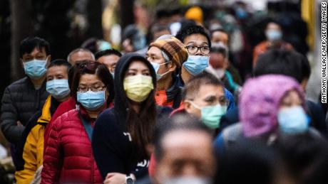 People wearing face masks following a coronavirus outbreak which began in the Chinese city of Wuhan.