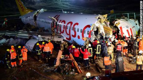 Rescuers work to reach injured passengers on the Pegasus Airlines jet on Wednesday night.